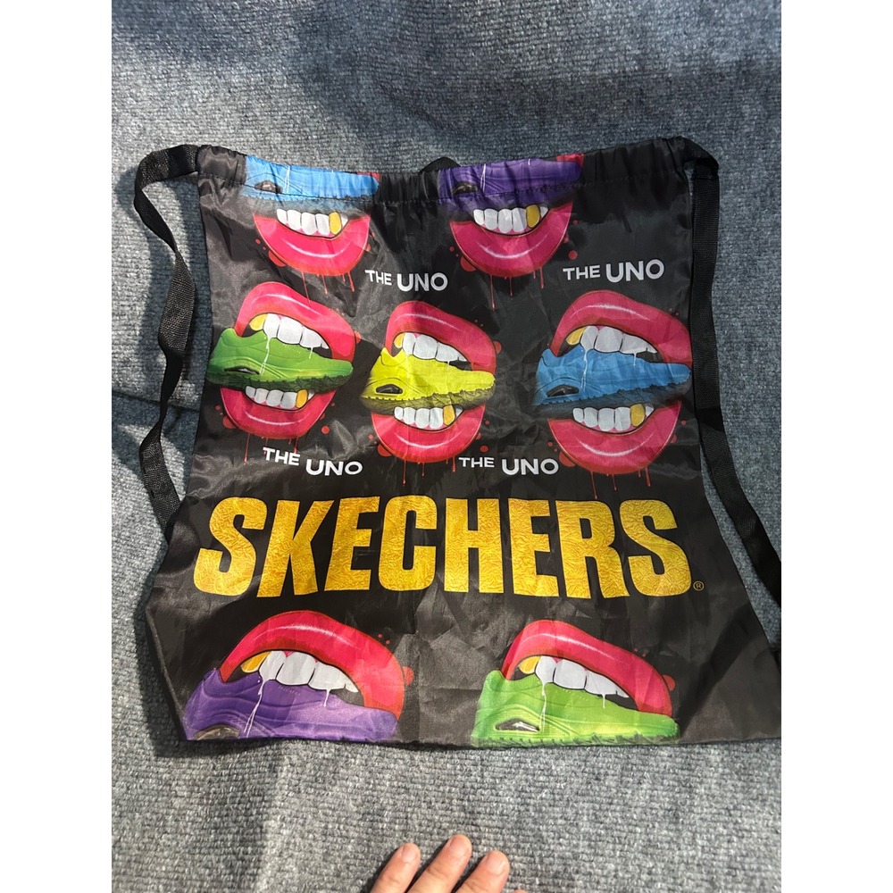 Skechers The Uno Cinch Drawstring Backpack Bag Black Graphic Lips Sneaker Print